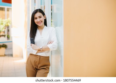 Portrait Of Beautiful Woman Business Executive Style In Downtown Urban Area