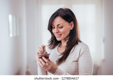 Portrait Of A Beautiful Woman Woman Eating Chocolate Pudding.