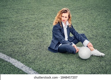 Portrait Of A Beautiful Woman Football Player In A Strict Office Suit, Concept Sports Office Manager Leisure