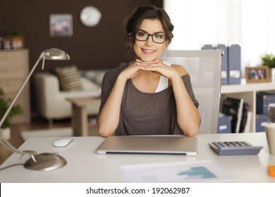 Portrait Of Beautiful Woman In Home Office 