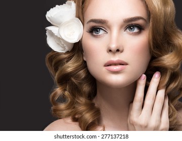  Portrait Of A Beautiful Woman In The Image Of The Bride With Flowers In Her Hair. Picture Taken In The Studio On A Black Background. Beauty Face