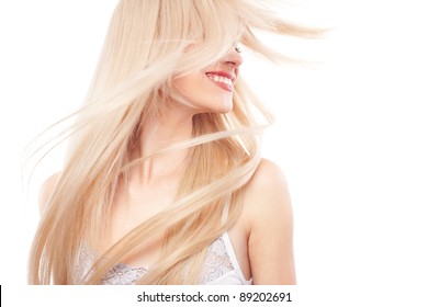 Portrait of beautiful woman with long blond hair over white