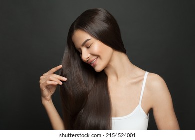 Portrait of a beautiful woman with long hair. Young brunette model with beautiful hairstyle