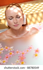 Portrait Of Beautiful Woman In Milk Bath