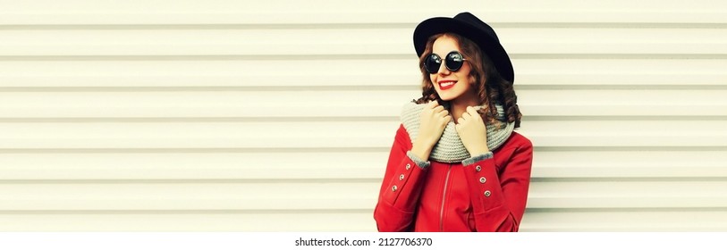 Portrait Of Beautiful Woman Model Wearing Scarf And Black Round Hat On White Background