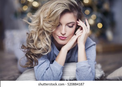 Portrait Of A Beautiful Woman Near The Christmas Tree