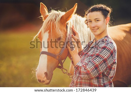 portrait beautiful woman next horse in warm summer sunny day