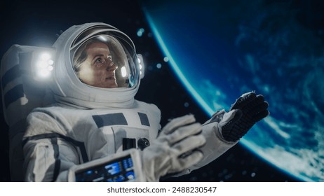 Portrait of a Beautiful Woman on Her First Spacewalk at an International Space Station. Empowered Female Astronaut Communicating with Crew Members, Excited to See Planet Earth from Outer Space - Powered by Shutterstock