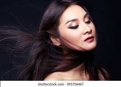 Portrait of beautiful woman with perfect make up and glossy hair