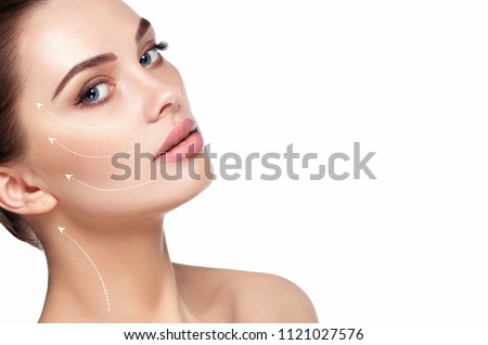 portrait of beautiful woman with perfect skin of the face, with arrows on face, concept of lifting skin. Cosmetology, elastic and young skin of the face.