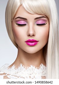 Portrait Of  A  Beautiful  Woman With Pink Make-up And White Straight  Hairs. Face Of A Fashion Model With Pink Lipstick. 