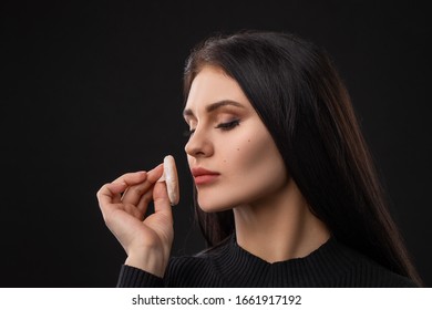 Portrait Of Beautiful Woman With Powder Puff. Girl Applying Makeup.