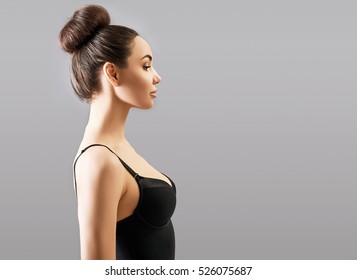 Portrait Of Beautiful Woman, Profile. Silhouette Of Attractive Girl In Studio Over Gray Background With Copy Space.