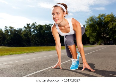 Portrait Of Beautiful Woman Ready To Start Running.