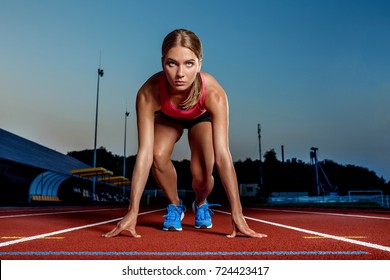 Portrait Of Beautiful Woman Ready To Start Running.