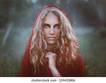 portrait of beautiful woman in red hood