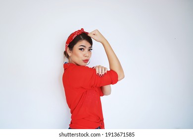 Portrait Beautiful Woman In Red Shirt Showing Her Bicep,We Can Do It,Woman’s Day Concept.