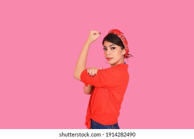 Portrait Beautiful Woman In Red Shirt Showing Her Bicep,We Can Do It,Woman’s Day Concept.