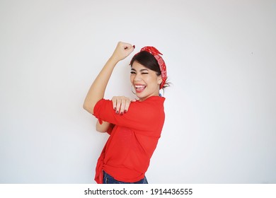 Portrait Beautiful Woman In Red Shirt Showing Her Bicep,We Can Do It,Woman’s Day Concept.