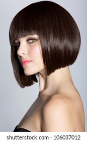 Portrait Of A Beautiful Woman In Short Brunette Bob With Neat Clean Hair On Studio Background