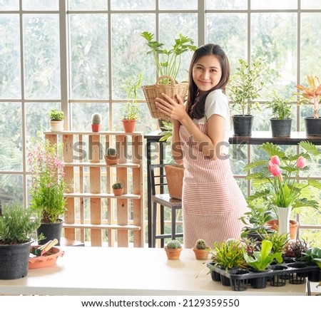 Similar – Image, Stock Photo Woman holding pink orchid