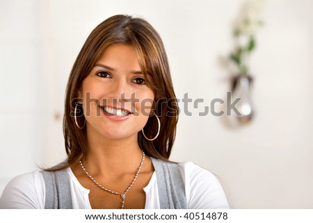 Portrait of a beautiful woman smiling indoors