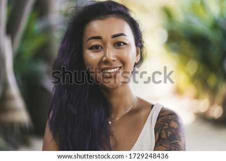 Portrait of a beautiful woman smiling outdoors