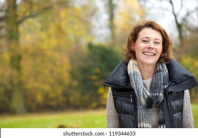 Portrait Of A Beautiful Woman Smiling In The Park