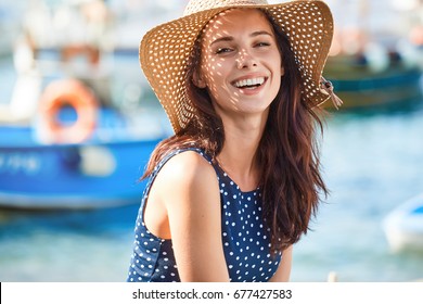 Portrait Of A Beautiful Woman In A Straw Hat. Laughing Girl. Summer Time