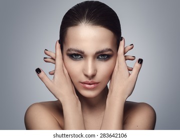 Portrait of beautiful woman with stylish make-up