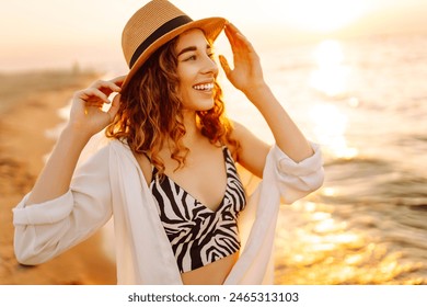 Portrait of the beautiful woman at the summer day relaxing on coast at sunset. Travel, weekend, relax and lifestyle concept. - Powered by Shutterstock