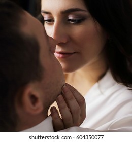 Portrait Of Beautiful Woman Touching Man's Face. Happy Couple