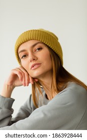 Portrait Of Beautiful Woman In Warm Clothing And Winter Hat Isolated On White Background No Makeup On  Background Studio