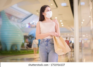 Portrait Of Beautiful Woman Is Wearing Face Mask In Shopping Center 