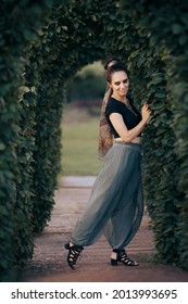 Portrait of a Beautiful Woman Wearing Harem Pants. Trendy fashionable model wearing ethnic inspired outfit with a modern twist
				