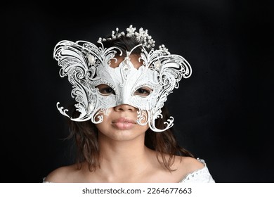  portrait of beautiful woman wearing  white  lace bridal fantasy  gown with butterfly mask. isolated on black studio background. - Powered by Shutterstock