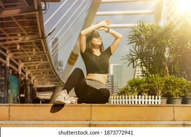 Portrait Beautiful Woman Who Exercises Outdoors, She Blocks Out The Sun Shines On Her Face, But She Doesn't Cover Her Skin Because She Needs Vitamin D, Which Is A Vital Part Of Building Strong Bones.