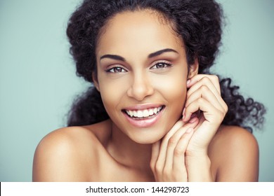 Portrait of a beautiful young African woman smiling.