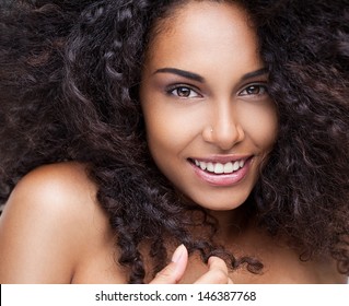 Portrait of a beautiful young African woman smiling.