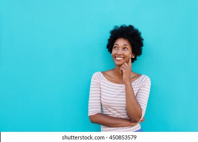 Portrait Of A Beautiful Young African Woman Smiling And Thinking