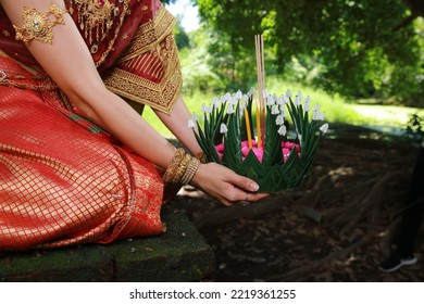 Portrait Beautiful Young Asia Woman With Traditional Thai Costume Hold Banana Leaf Cockerel Or Kra Thong In Thai , Loy Krathong Festival On November