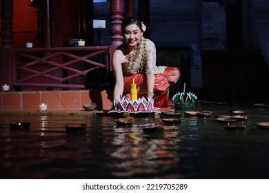 Portrait Beautiful Young Asia Woman With Traditional Thai Costume Hold Banana Leaf Cockerel Or Kra Thong In Thai , Loy Krathong Festival On November