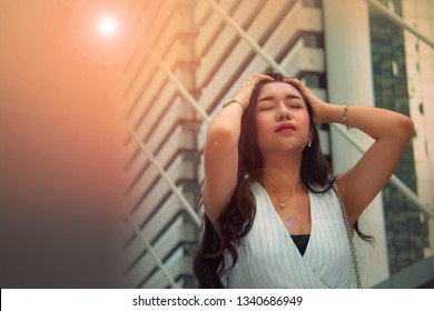 Portrait Beautiful Young Asian, Long Hair, Feel Bored And Annoyed In The Sweltering Weather In The City During The Outdoor Months In The Summer Daytime : Copy Space
