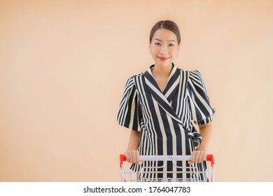 Portrait Beautiful Young Asian Woman With Shopping Cart For Shopping Grocery