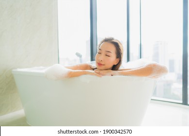 Portrait beautiful young asian woman relax and leisure in bathtub decoration in bathroom interior