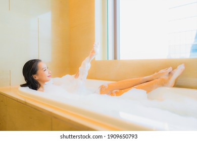 Portrait beautiful young asian woman relax smile leisure in bathtub at bathroom interior