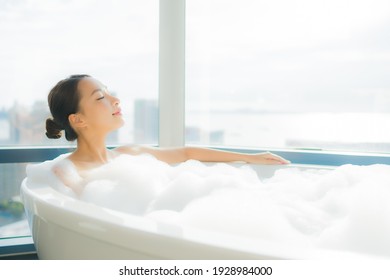 Portrait beautiful young asian woman relax enjoy in bathtub in bathroom interior