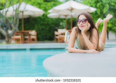 Portrait Beautiful Young Asian Woman Relax Smile Around Outdoor Swimming Pool In Hotel Resort For Leisure Vacation