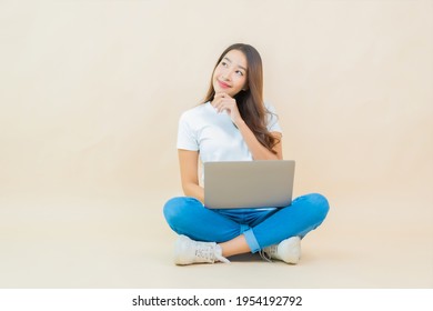 Portrait Beautiful Young Asian Woman Use Computer Laptop On Cream Color Background