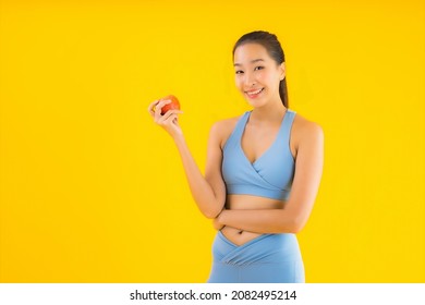 Portrait Beautiful Young Asian Woman Wear Sportwear Ready For Exercise With Apple Fruit Isolated Background